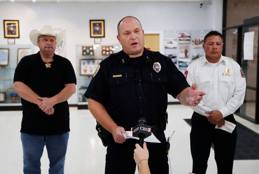 Odessa Police Chief Michael Gerke talks to the media in the Odessa Police Department in Odessa, Texas, Saturday, Aug. 31, 2019, after a man fired at random in the area of Odessa and Midland. Several people were dead after a gunman who hijacked a postal service vehicle in West Texas shot more than 20 people, authorities said Saturday. The gunman was killed and a few law enforcement officers were among the injured. (Mark Rogers/Odessa American via AP) Odessa Police Chief Michael Gerke talks to the media in the Odessa Police Department in Odessa, Texas, Saturday, Aug. 31, 2019, after a man fired at random in the area of Odessa and Midland. Several people were dead after a gunman who hijacked a postal service vehicle in West Texas shot more than 20 people, authorities said Saturday. The gunman was killed and a few law enforcement officers were among the injured. (Mark Rogers/Odessa American via AP)