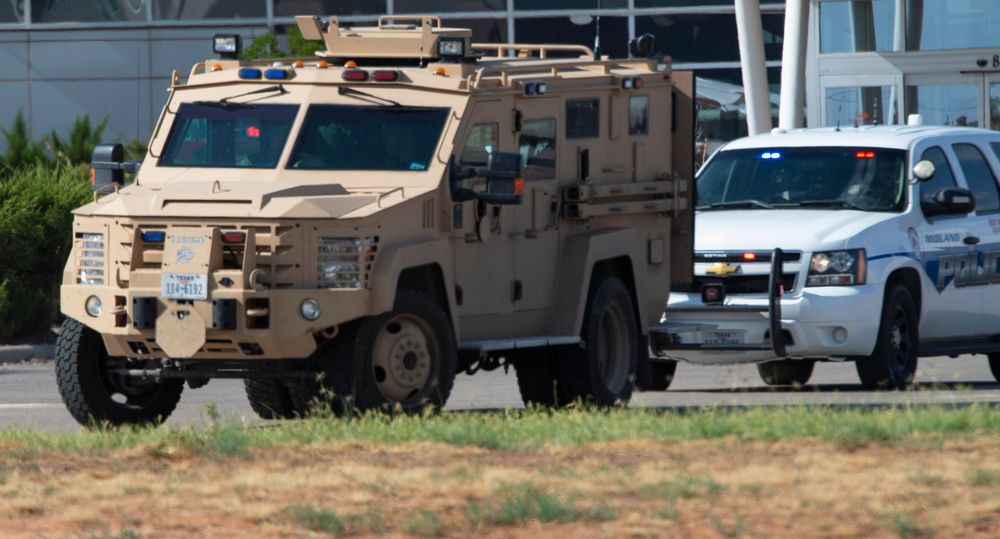 CORRECTS THE NAME OF THE SOURCE TO THE MIDLAND REPORTER-TELEGRAM - Odessa and Midland police and sheriff's deputies surround the area behind Cinergy movie theater in Odessa, Texas, Saturday, Aug. 31, 2019, after reports of gunfire. Police said there are CORRECTS THE NAME OF THE SOURCE TO THE MIDLAND REPORTER-TELEGRAM - Odessa and Midland police and sheriff's deputies surround the area behind Cinergy movie theater in Odessa, Texas, Saturday, Aug. 31, 2019, after reports of gunfire. Police said there are
