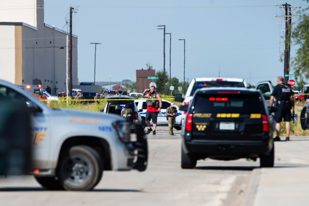 CORRECTS THE NAME OF THE SOURCE TO THE MIDLAND REPORTER-TELEGRAM - Odessa and Midland police and sheriff's deputies surround the area behind Cinergy in Odessa, Texas, Saturday, Aug. 31, 2019, after reports of shootings. Police said there are CORRECTS THE NAME OF THE SOURCE TO THE MIDLAND REPORTER-TELEGRAM - Odessa and Midland police and sheriff's deputies surround the area behind Cinergy in Odessa, Texas, Saturday, Aug. 31, 2019, after reports of shootings. Police said there are