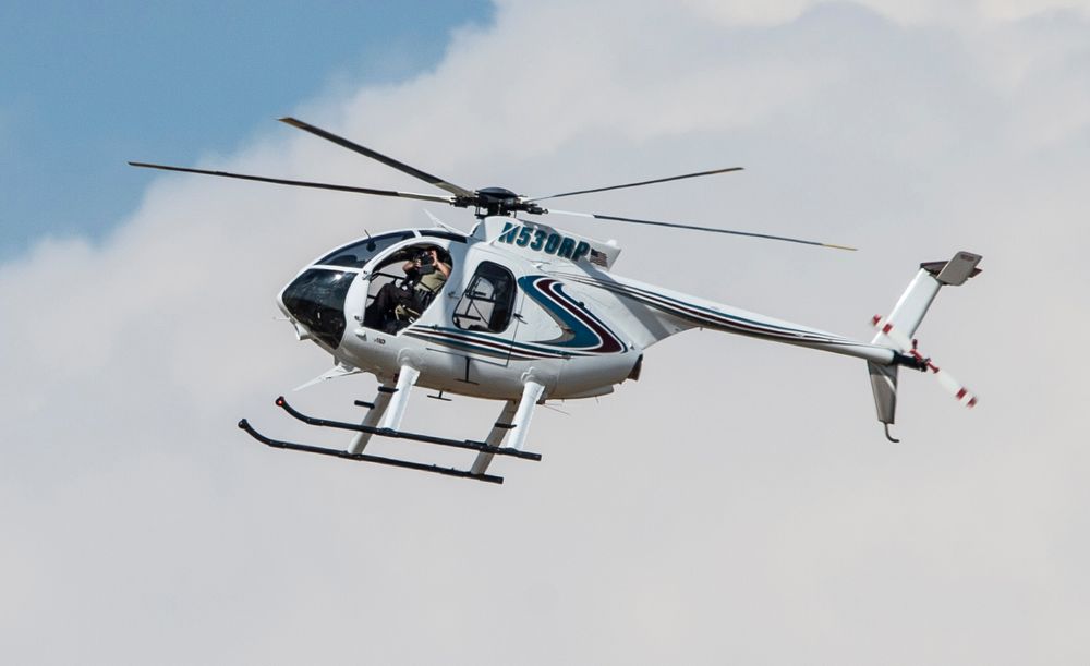 An authorities chopper flies over an area in Odessa, Texas, Saturday, Aug. 31, 2019, after reports of gunfire. Police said there are An authorities chopper flies over an area in Odessa, Texas, Saturday, Aug. 31, 2019, after reports of gunfire. Police said there are