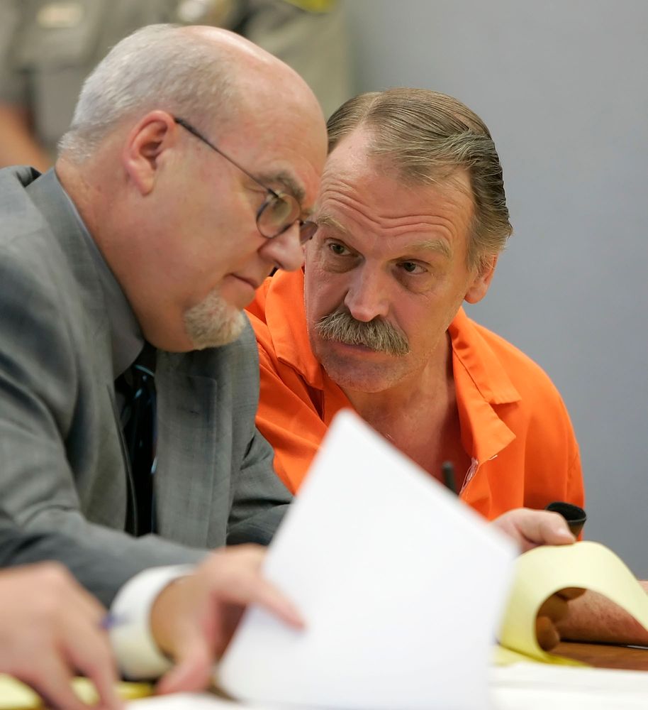 FILE - In this Oct. 6, 2005, file photo, Ron Lafferty, right, confers with his attorney Bill Morrison at his court hearing in the 4th District Courtroom of Judge Anthony Schofield in Provo, Utah. Utah prison officials said Monday, Nov. 11, 2019, that Lafferty, a death-row inmate whose double-murder case was featured in the book FILE - In this Oct. 6, 2005, file photo, Ron Lafferty, right, confers with his attorney Bill Morrison at his court hearing in the 4th District Courtroom of Judge Anthony Schofield in Provo, Utah. Utah prison officials said Monday, Nov. 11, 2019, that Lafferty, a death-row inmate whose double-murder case was featured in the book