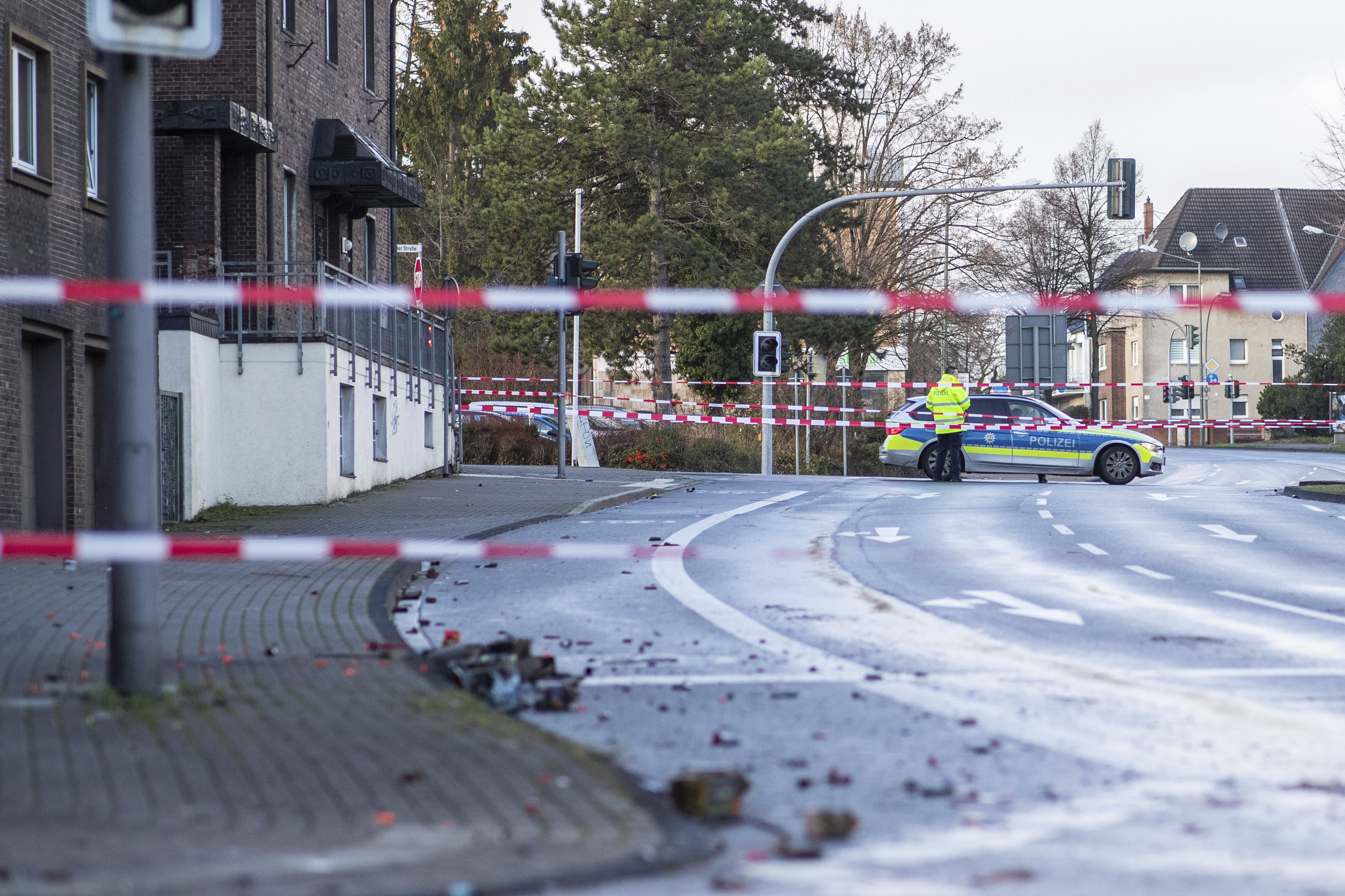 The Police blocks a road in Bottrop, Germany, Tuesday, Jan. 1, 2019. A man has been arrested in Germany after ploughing his car into a crowd of people, injuring at least four, in what appears to have been an intentional attack directed at foreigners, police said Tuesday. (Marcel Kusch/dpa via AP) The Police blocks a road in Bottrop, Germany, Tuesday, Jan. 1, 2019. A man has been arrested in Germany after ploughing his car into a crowd of people, injuring at least four, in what appears to have been an intentional attack directed at foreigners, police said Tuesday. (Marcel Kusch/dpa via AP)