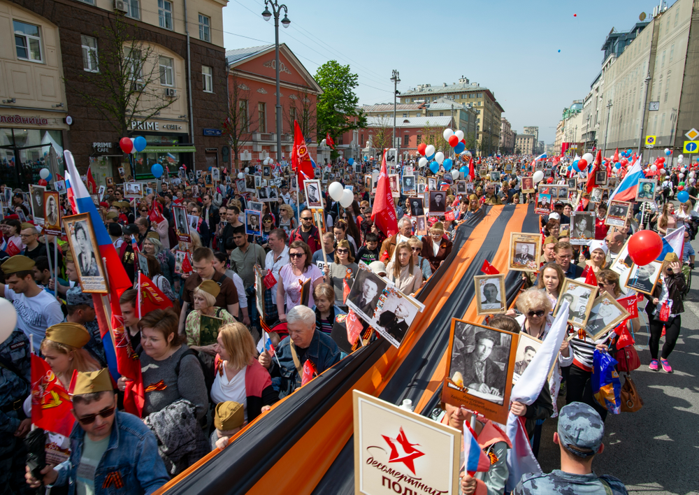 People carry portraits of relatives who fought in World War II, and St. George's ribbon, during the Immortal Regiment march through the main street toward Red Square in Moscow, Russia, Thursday, May 9, 2019, celebrating 74 years since the end of WWII and the defeat of Nazi Germany. (AP Photo/Dmitry Serebryakov) People carry portraits of relatives who fought in World War II, and St. George's ribbon, during the Immortal Regiment march through the main street toward Red Square in Moscow, Russia, Thursday, May 9, 2019, celebrating 74 years since the end of WWII and the defeat of Nazi Germany. (AP Photo/Dmitry Serebryakov)