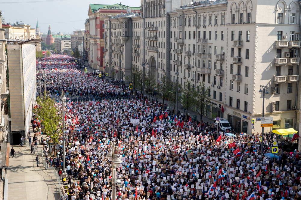 People carry portraits of relatives who fought in World War II, and Russian and Soviet flags, during the Immortal Regiment march through the main street toward Red Square celebrating 74 years since the victory in WWII in Red Square in Moscow, Russia, Thursday, May 9, 2019. (AP Photo/Denis Tyrin) People carry portraits of relatives who fought in World War II, and Russian and Soviet flags, during the Immortal Regiment march through the main street toward Red Square celebrating 74 years since the victory in WWII in Red Square in Moscow, Russia, Thursday, May 9, 2019. (AP Photo/Denis Tyrin)