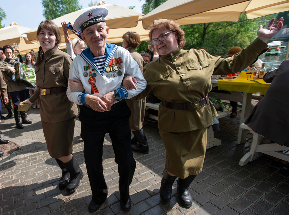 Victor Novopashin, 87, a Russian WWII veteran dances with two women dressed in Soviet era uniform celebrate 74 years since the victory in WWII in Gorky Park in Moscow, Russia, Thursday, May 9, 2019. (AP Photo/Alexander Zemlianichenko Jr.) Victor Novopashin, 87, a Russian WWII veteran dances with two women dressed in Soviet era uniform celebrate 74 years since the victory in WWII in Gorky Park in Moscow, Russia, Thursday, May 9, 2019. (AP Photo/Alexander Zemlianichenko Jr.)