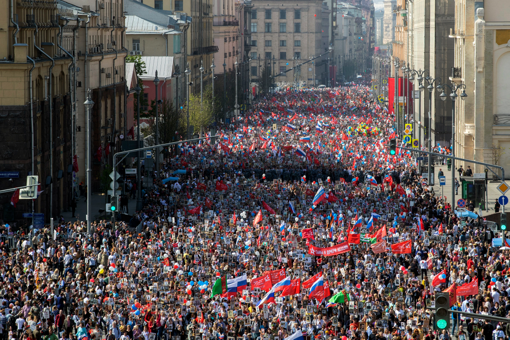 People carry portraits of relatives who fought in World War II, and Russian and Soviet flags, during the Immortal Regiment march through the main street toward Red Square celebrating 74 years since the victory in WWII in Red Square in Moscow, Russia, Thursday, May 9, 2019. (AP Photo/Denis Tyrin) People carry portraits of relatives who fought in World War II, and Russian and Soviet flags, during the Immortal Regiment march through the main street toward Red Square celebrating 74 years since the victory in WWII in Red Square in Moscow, Russia, Thursday, May 9, 2019. (AP Photo/Denis Tyrin)
