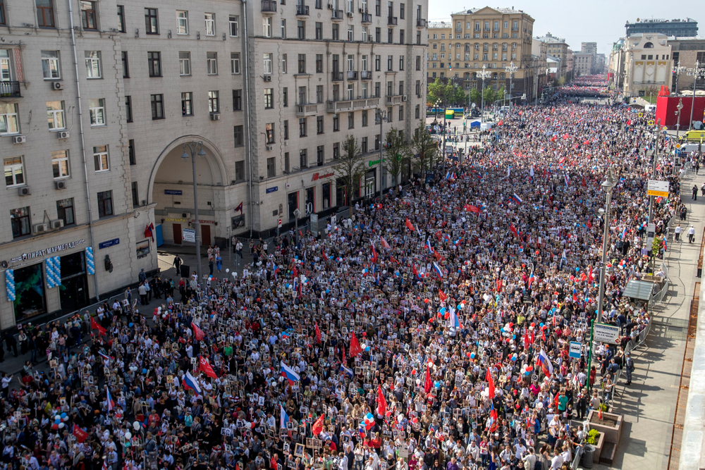 People carry portraits of relatives who fought in World War II, and Russian and Soviet flags, during the Immortal Regiment march through the main street toward Red Square celebrating 74 years since the victory in WWII in Red Square in Moscow, Russia, Thursday, May 9, 2019. (AP Photo/Denis Tyrin) People carry portraits of relatives who fought in World War II, and Russian and Soviet flags, during the Immortal Regiment march through the main street toward Red Square celebrating 74 years since the victory in WWII in Red Square in Moscow, Russia, Thursday, May 9, 2019. (AP Photo/Denis Tyrin)