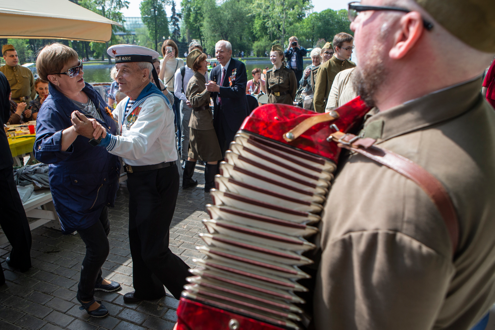 Victor Novopashin, 87, a Russian WWII veteran, second left, dances with a woman celebrating 74 years since the victory in WWII in Gorky Park in Moscow, Russia, Thursday, May 9, 2019. (AP Photo/Alexander Zemlianichenko Jr.) Victor Novopashin, 87, a Russian WWII veteran, second left, dances with a woman celebrating 74 years since the victory in WWII in Gorky Park in Moscow, Russia, Thursday, May 9, 2019. (AP Photo/Alexander Zemlianichenko Jr.)