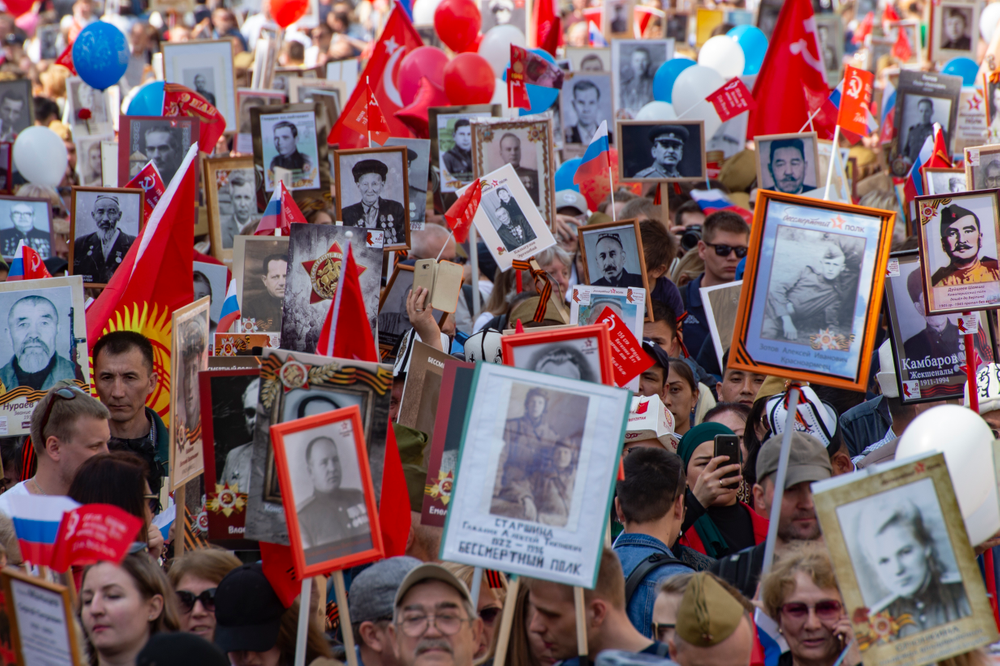 People carry portraits of relatives who fought in World War II, and Russian and Soviet flags, during the Immortal Regiment march through the main street toward Red Square in Moscow, Russia, Thursday, May 9, 2019, celebrating 74 years since the end of WWII and the defeat of Nazi Germany. (AP Photo/Dmitry Serebryakov) People carry portraits of relatives who fought in World War II, and Russian and Soviet flags, during the Immortal Regiment march through the main street toward Red Square in Moscow, Russia, Thursday, May 9, 2019, celebrating 74 years since the end of WWII and the defeat of Nazi Germany. (AP Photo/Dmitry Serebryakov)