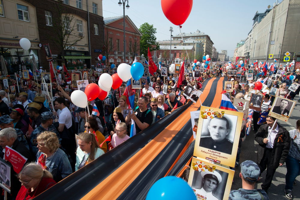 People carry portraits of relatives who fought in World War II, and St. George's ribbon, during the Immortal Regiment march through the main street toward Red Square in Moscow, Russia, Thursday, May 9, 2019, celebrating 74 years since the end of WWII and the defeat of Nazi Germany. (AP Photo/Dmitry Serebryakov) People carry portraits of relatives who fought in World War II, and St. George's ribbon, during the Immortal Regiment march through the main street toward Red Square in Moscow, Russia, Thursday, May 9, 2019, celebrating 74 years since the end of WWII and the defeat of Nazi Germany. (AP Photo/Dmitry Serebryakov)