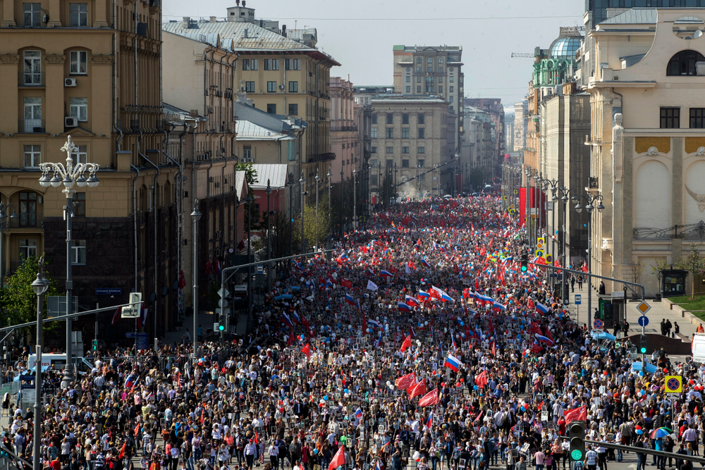 People carry portraits of relatives who fought in World War II, and Russian and Soviet flags, during the Immortal Regiment march through the main street toward Red Square celebrating 74 years since the victory in WWII in Red Square in Moscow, Russia, Thursday, May 9, 2019. (AP Photo/Denis Tyrin) People carry portraits of relatives who fought in World War II, and Russian and Soviet flags, during the Immortal Regiment march through the main street toward Red Square celebrating 74 years since the victory in WWII in Red Square in Moscow, Russia, Thursday, May 9, 2019. (AP Photo/Denis Tyrin)