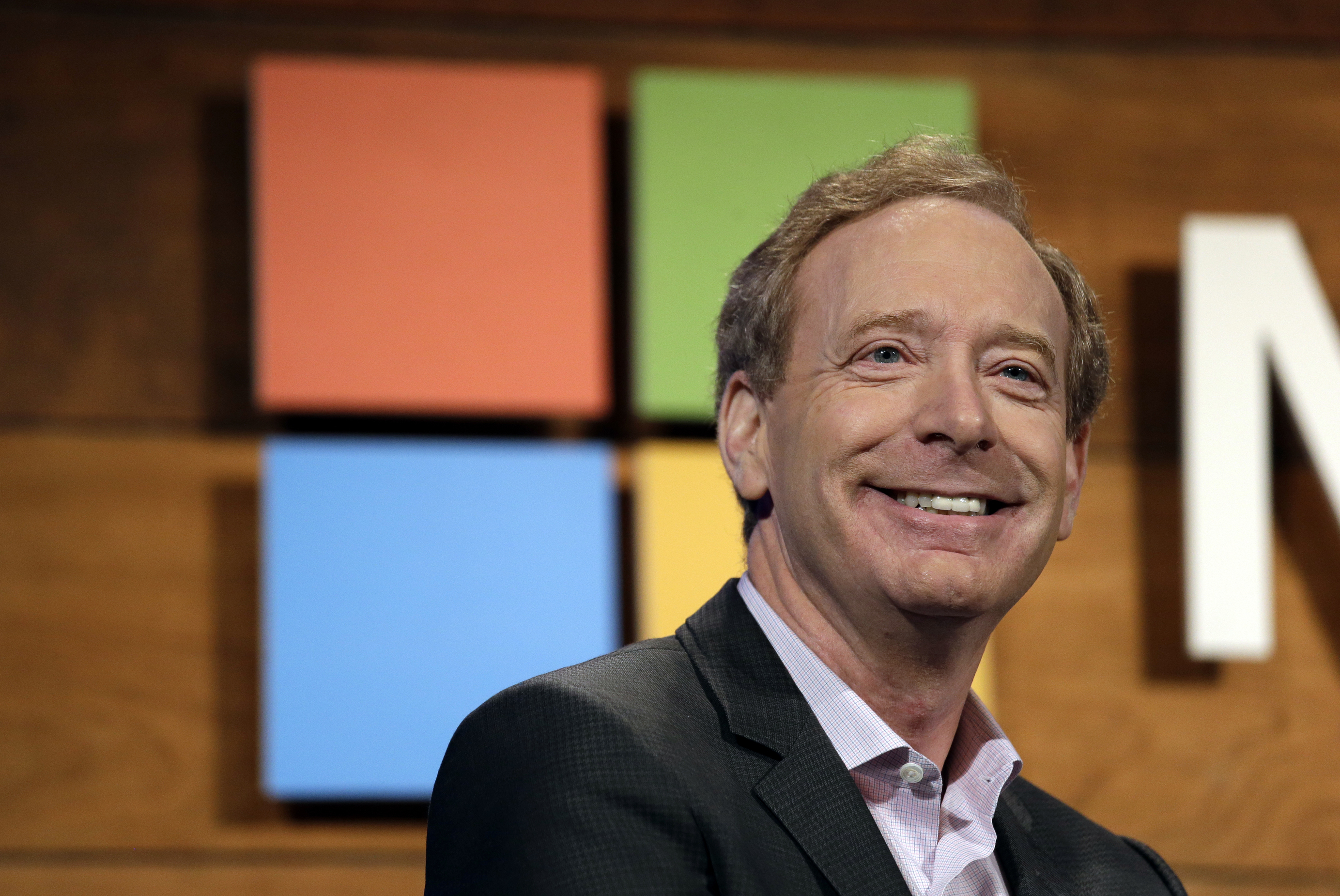 FILE - In this Nov. 30, 2016 file photo, Microsoft's Brad Smith, president and chief legal officer, speaks at the annual Microsoft shareholders meeting in Bellevue, Wash. Microsoft has pledged $500 million to address homelessness and develop affordable housing in response to the Seattle region's widening affordability gap. Most of the money will be aimed at increasing housing options in the Puget Sound region for low- and middle-income workers at a time when they're being priced out of Seattle and some of its suburbs, and when the vast majority of new buildings target wealthier renters, said Smith. (AP Photo/Elaine Thompson, File) FILE - In this Nov. 30, 2016 file photo, Microsoft's Brad Smith, president and chief legal officer, speaks at the annual Microsoft shareholders meeting in Bellevue, Wash. Microsoft has pledged $500 million to address homelessness and develop affordable housing in response to the Seattle region's widening affordability gap. Most of the money will be aimed at increasing housing options in the Puget Sound region for low- and middle-income workers at a time when they're being priced out of Seattle and some of its suburbs, and when the vast majority of new buildings target wealthier renters, said Smith. (AP Photo/Elaine Thompson, File)