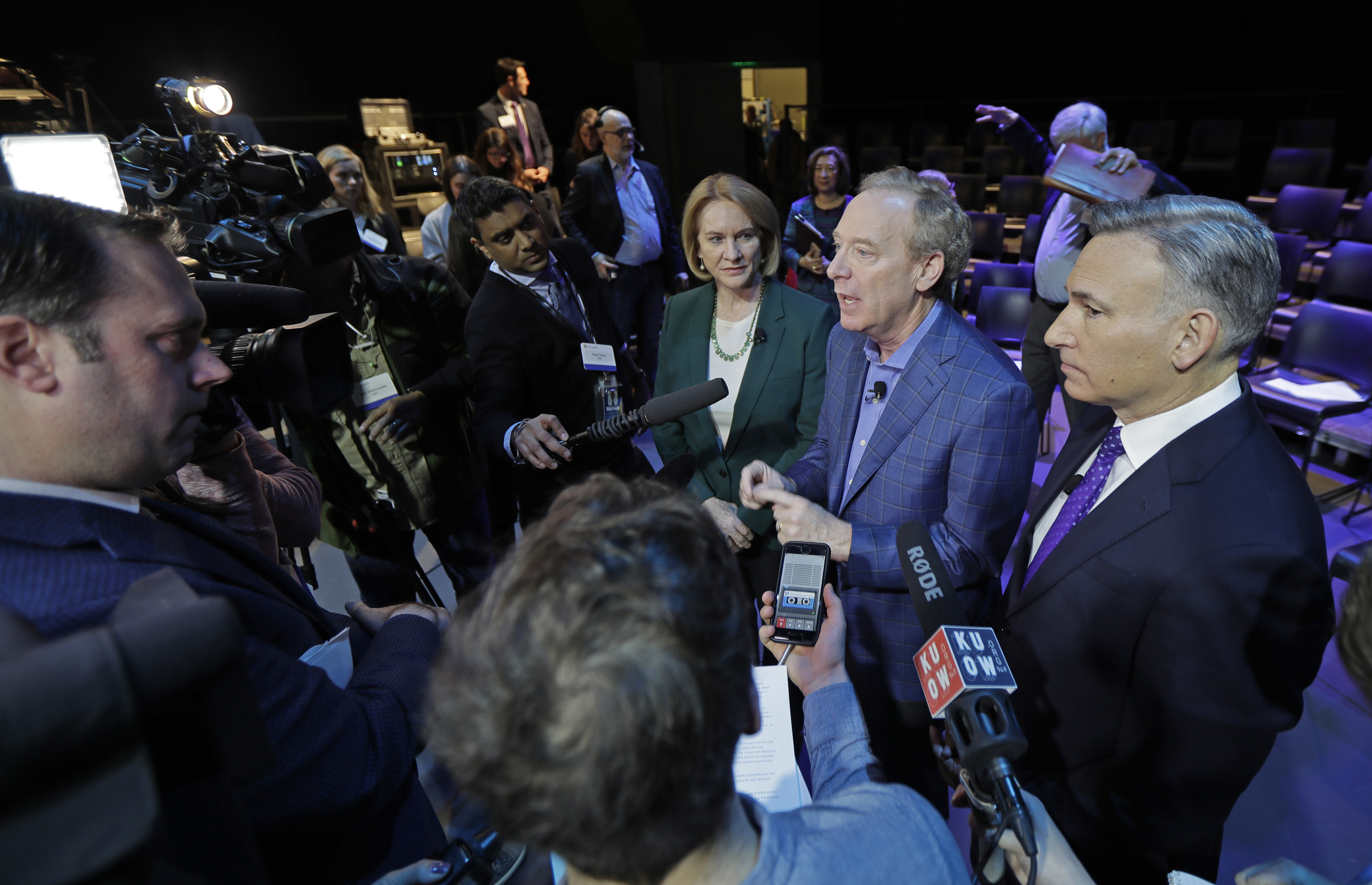 Microsoft Corp. President Brad Smith, second from right, talks to reporters as Seattle Mayor Jenny Durkan, third from right, and King County Executive Dow Constantine, right, look on, Thursday, Jan. 17, 2019, following a news conference in Bellevue, Wash., to announce a $500 million pledge by Microsoft Corp. to develop affordable housing for low- and middle-income workers in response to the Seattle region's widening affordability gap and to also to address homelessness. (AP Photo/Ted S. Warren) Microsoft Corp. President Brad Smith, second from right, talks to reporters as Seattle Mayor Jenny Durkan, third from right, and King County Executive Dow Constantine, right, look on, Thursday, Jan. 17, 2019, following a news conference in Bellevue, Wash., to announce a $500 million pledge by Microsoft Corp. to develop affordable housing for low- and middle-income workers in response to the Seattle region's widening affordability gap and to also to address homelessness. (AP Photo/Ted S. Warren)