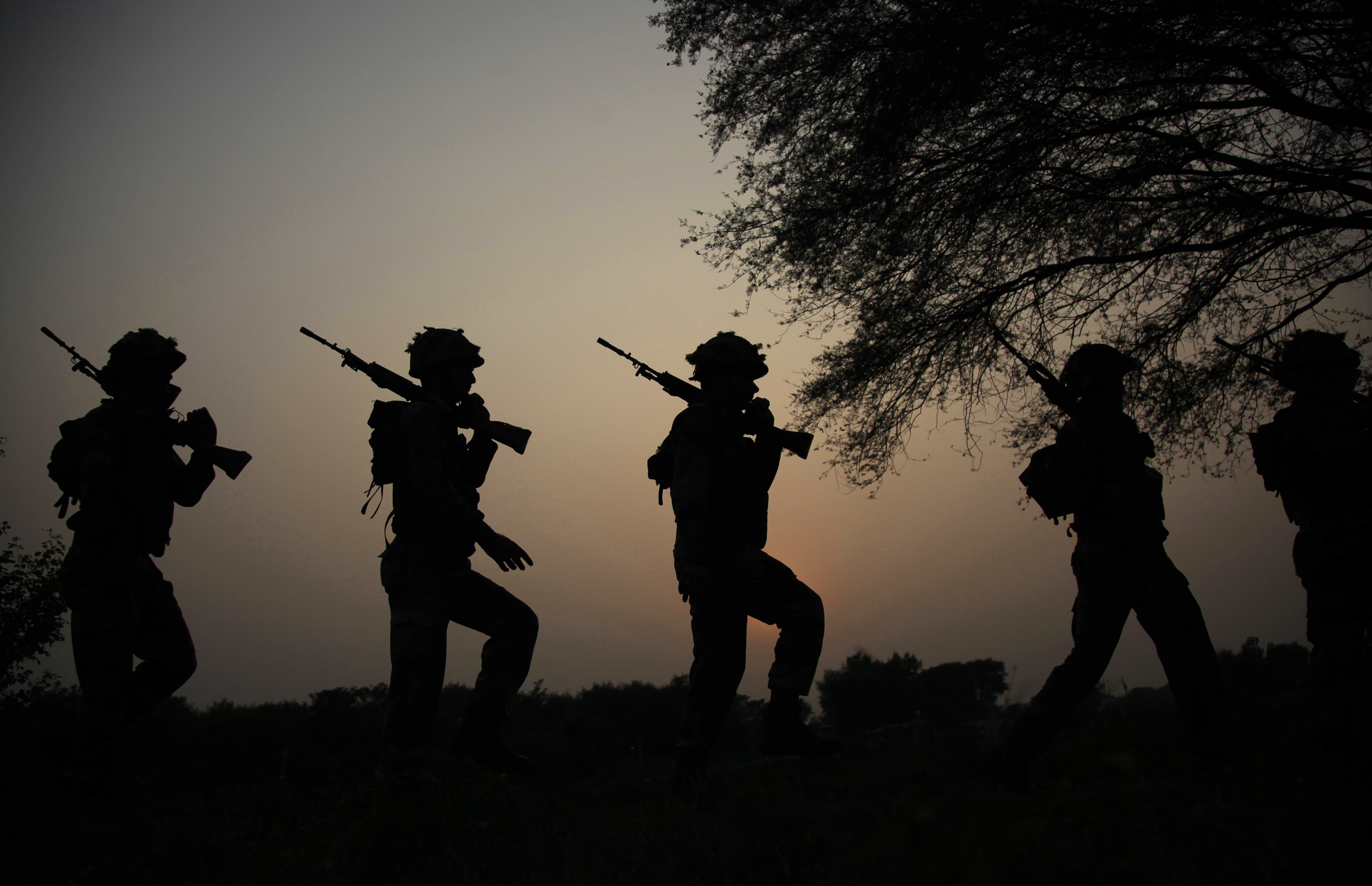 FILE - In this Oct. 2, 2016 file photo, Indian army soldiers patrol near the Line of Control in Nowshera sector, about 90 kilometers from Jammu, India. As India considers its response to the suicide car bombing of a paramilitary convoy in Kashmir that killed dozens of soldiers on Feb. 14, 2019, a retired military commander who oversaw a much-lauded military strike against neighboring Pakistan in 2016 has urged caution. (AP Photo/Channi Anand, File) FILE - In this Oct. 2, 2016 file photo, Indian army soldiers patrol near the Line of Control in Nowshera sector, about 90 kilometers from Jammu, India. As India considers its response to the suicide car bombing of a paramilitary convoy in Kashmir that killed dozens of soldiers on Feb. 14, 2019, a retired military commander who oversaw a much-lauded military strike against neighboring Pakistan in 2016 has urged caution. (AP Photo/Channi Anand, File)