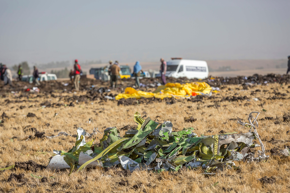 FILE- In this March 11, 2019, file photo parts of the plane wreckage with rescue workers at the crash site at Bishoftu, or Debre Zeit, outside Addis Ababa, Ethiopia. Investigators have determined that an anti-stall system automatically activated before the Ethiopian Airlines Boeing 737 Max jet plunged into the ground, The Wall Street Journal reported Friday, March 29. (AP Photo/Mulugeta Ayene, File) FILE- In this March 11, 2019, file photo parts of the plane wreckage with rescue workers at the crash site at Bishoftu, or Debre Zeit, outside Addis Ababa, Ethiopia. Investigators have determined that an anti-stall system automatically activated before the Ethiopian Airlines Boeing 737 Max jet plunged into the ground, The Wall Street Journal reported Friday, March 29. (AP Photo/Mulugeta Ayene, File)