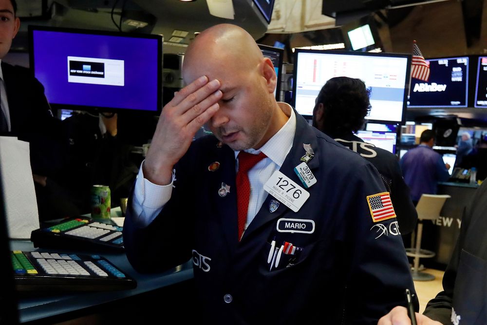 Specialist Mario Picone works on the floor of the New York Stock Exchange, Wednesday, Aug. 14, 2019. The Dow Jones Industrial Average sank 800 points after the bond market flashed a warning sign about a possible recession for the first time since 2007. (AP Photo/Richard Drew) Specialist Mario Picone works on the floor of the New York Stock Exchange, Wednesday, Aug. 14, 2019. The Dow Jones Industrial Average sank 800 points after the bond market flashed a warning sign about a possible recession for the first time since 2007. (AP Photo/Richard Drew)