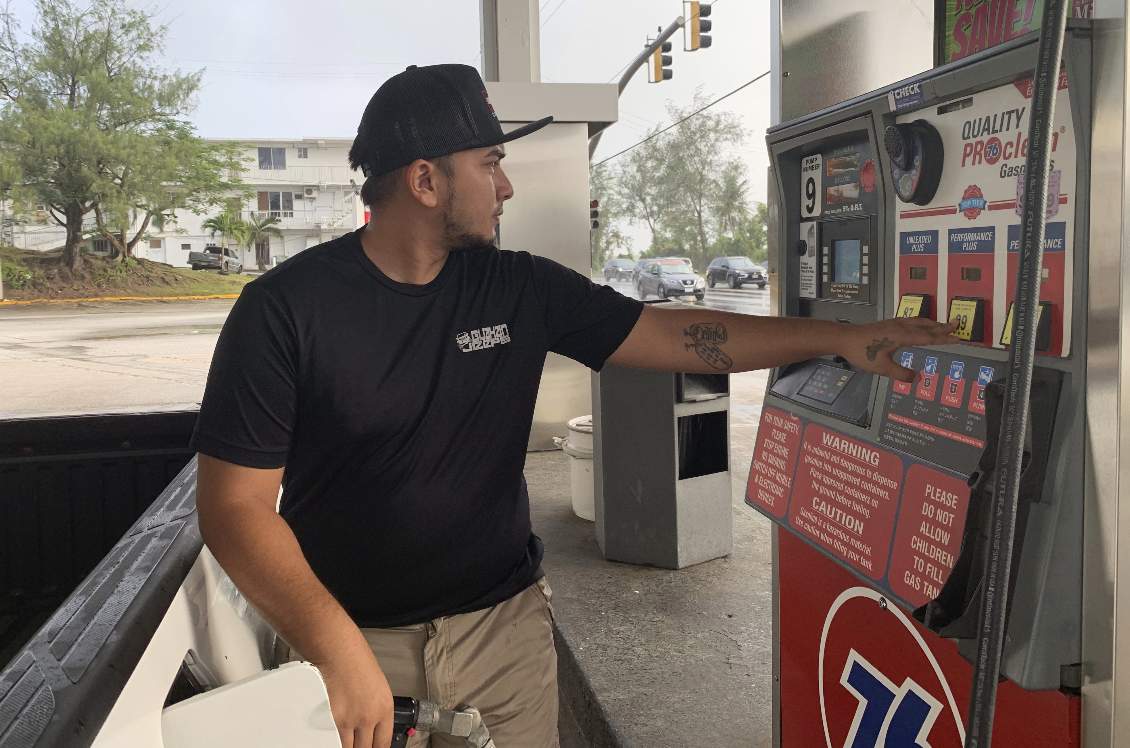 Jared Duenas fills up his pickup truck with gasoline in the village of Sinajana, Guam in preparation of a typhoon on Thursday, Feb. 21, 2019. An intensifying tropical storm in the Pacific is bearing down on Micronesia and could threaten the U.S. territory of Guam in the coming days. (AP Photo/Grace Garces Bordallo) Jared Duenas fills up his pickup truck with gasoline in the village of Sinajana, Guam in preparation of a typhoon on Thursday, Feb. 21, 2019. An intensifying tropical storm in the Pacific is bearing down on Micronesia and could threaten the U.S. territory of Guam in the coming days. (AP Photo/Grace Garces Bordallo)