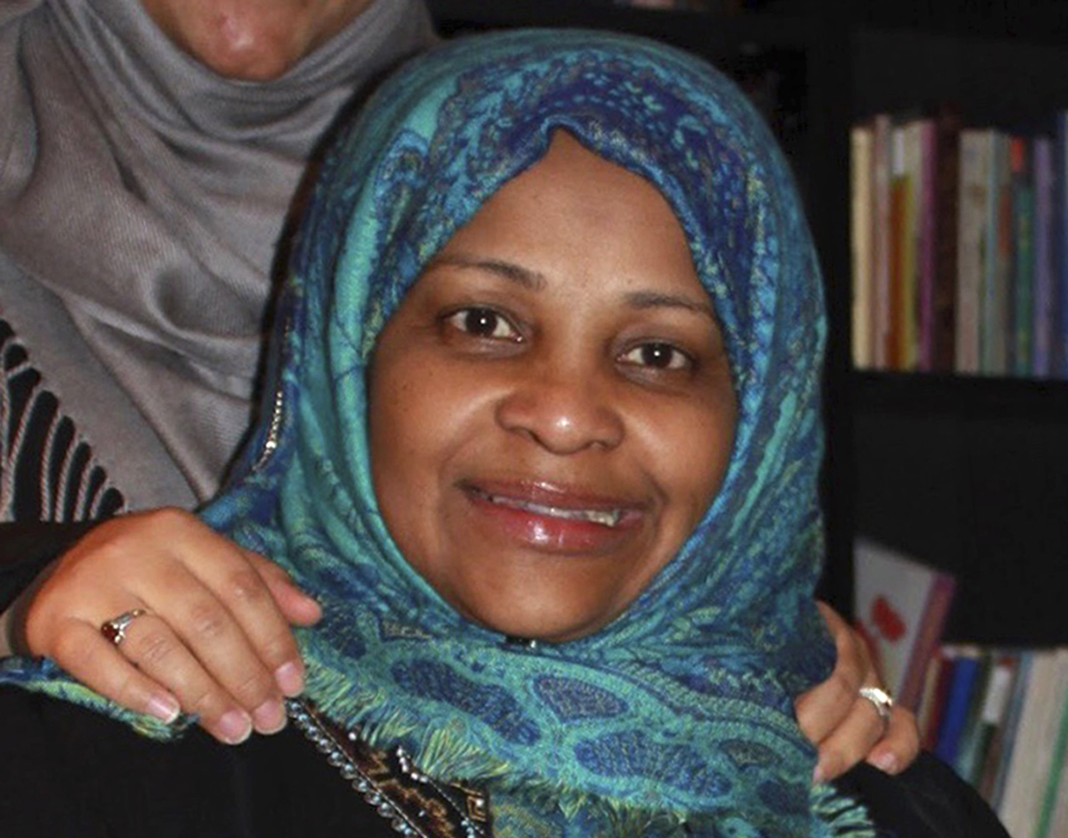 In this image provided by Hossein Hashemi, Marzieh Hashemi, poses for a photo. Marzieh Hashemi, a prominent American anchorwoman on Iranian state television has been arrested by the FBI during a visit to the U.S., the broadcaster reported Wednesday, Jan. 16, 2019, and her son said she was being held in a prison, apparently as a material witness. (Hossein Hashemi via AP) In this image provided by Hossein Hashemi, Marzieh Hashemi, poses for a photo. Marzieh Hashemi, a prominent American anchorwoman on Iranian state television has been arrested by the FBI during a visit to the U.S., the broadcaster reported Wednesday, Jan. 16, 2019, and her son said she was being held in a prison, apparently as a material witness. (Hossein Hashemi via AP)