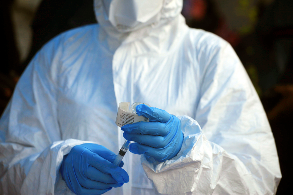 FILE - In this file photo dated Wednesday, Aug 8, 2018, a healthcare worker from the World Health Organization prepares to give an Ebola vaccination in Mangina, Democratic Republic of Congo. Armed assailants attacked an Ebola treatment center in Butembo, in the heart of eastern Congo’s deadly outbreak on Saturday March 9, 2019, with the mayor reporting one police officer killed. (AP Photo/Al-hadji Kudra Maliro, FILE) FILE - In this file photo dated Wednesday, Aug 8, 2018, a healthcare worker from the World Health Organization prepares to give an Ebola vaccination in Mangina, Democratic Republic of Congo. Armed assailants attacked an Ebola treatment center in Butembo, in the heart of eastern Congo’s deadly outbreak on Saturday March 9, 2019, with the mayor reporting one police officer killed. (AP Photo/Al-hadji Kudra Maliro, FILE)