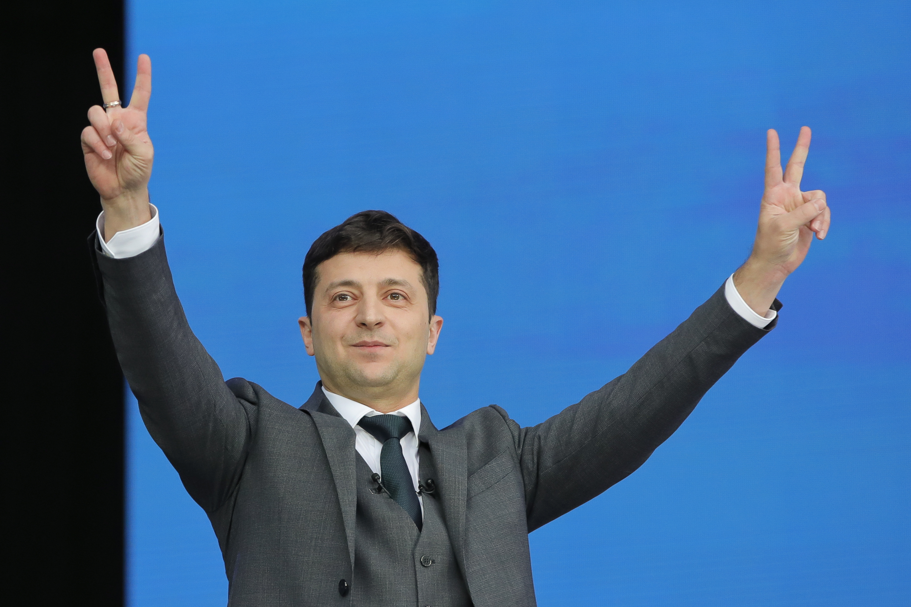Ukrainian presidential candidate and popular comedian Volodymyr Zelenskiy makes the victory sign during the debate with Ukrainian President Petro Poroshenko at the Olympic stadium in Kiev, Ukraine, Friday, April 19, 2019. Friday is the last official day of election canvassing in Ukraine as all presidential candidates and their campaigns will be barred from campaigning on Saturday, the day before the vote. (AP Photo/Vadim Ghirda) Ukrainian presidential candidate and popular comedian Volodymyr Zelenskiy makes the victory sign during the debate with Ukrainian President Petro Poroshenko at the Olympic stadium in Kiev, Ukraine, Friday, April 19, 2019. Friday is the last official day of election canvassing in Ukraine as all presidential candidates and their campaigns will be barred from campaigning on Saturday, the day before the vote. (AP Photo/Vadim Ghirda)