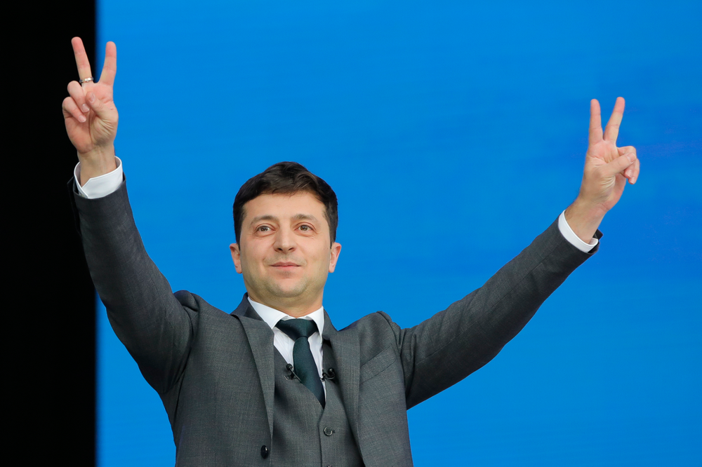 Ukrainian presidential candidate and popular comedian Volodymyr Zelenskiy makes the victory sign during the debate with Ukrainian President Petro Poroshenko at the Olympic stadium in Kiev, Ukraine, Friday, April 19, 2019. Friday is the last official day of election canvassing in Ukraine as all presidential candidates and their campaigns will be barred from campaigning on Saturday, the day before the vote. (AP Photo/Vadim Ghirda) Ukrainian presidential candidate and popular comedian Volodymyr Zelenskiy makes the victory sign during the debate with Ukrainian President Petro Poroshenko at the Olympic stadium in Kiev, Ukraine, Friday, April 19, 2019. Friday is the last official day of election canvassing in Ukraine as all presidential candidates and their campaigns will be barred from campaigning on Saturday, the day before the vote. (AP Photo/Vadim Ghirda)