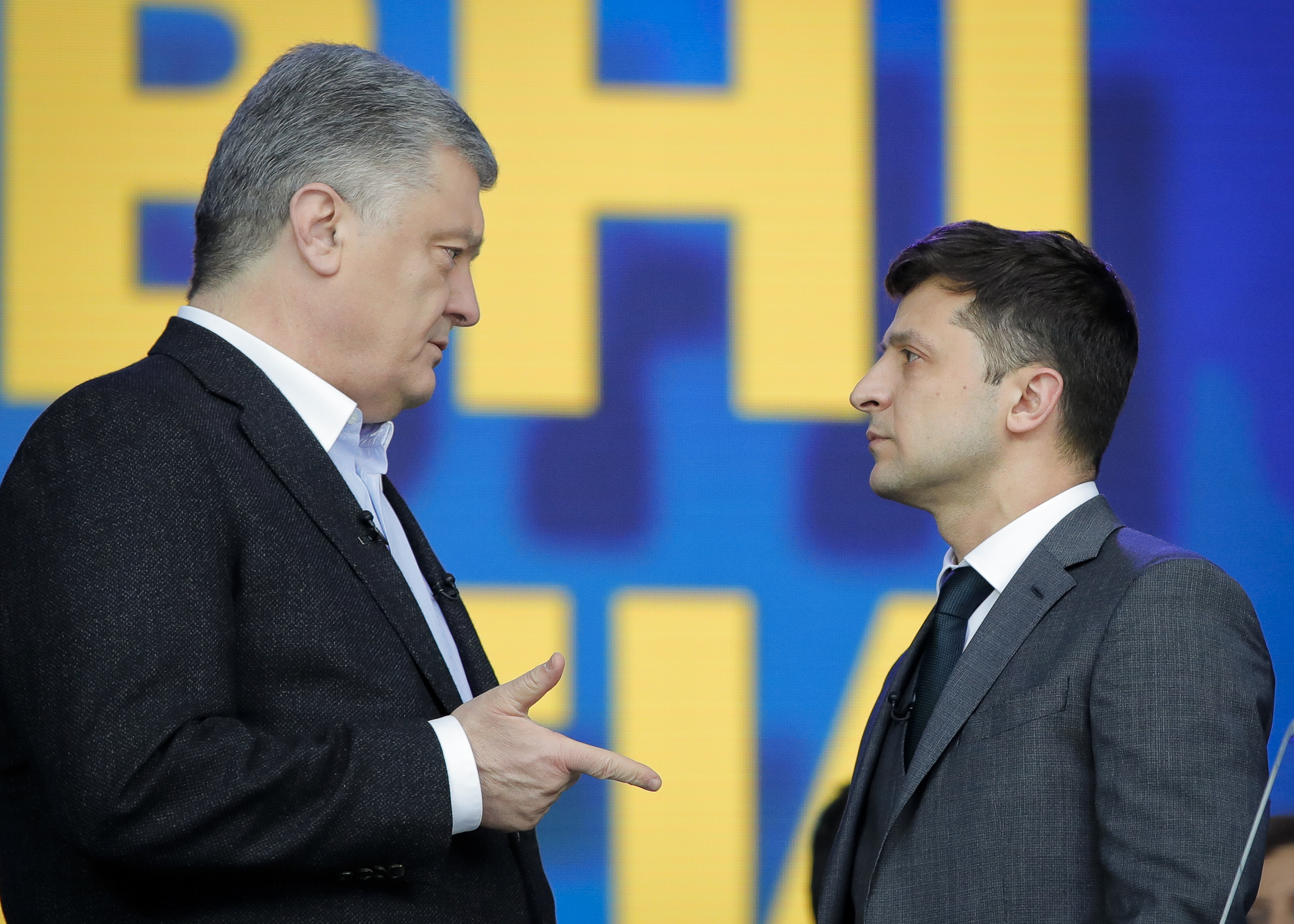 Ukrainian presidential candidate and popular comedian Volodymyr Zelenskiy listens to Ukrainian President Petro Poroshenko during their final electoral campaign debate at the Olympic stadium in Kiev, Ukraine, Friday, April 19, 2019. Friday is the last official day of election canvassing in Ukraine as all presidential candidates and their campaigns will be barred from campaigning on Saturday, the day before the vote. (AP Photo/Vadim Ghirda) Ukrainian presidential candidate and popular comedian Volodymyr Zelenskiy listens to Ukrainian President Petro Poroshenko during their final electoral campaign debate at the Olympic stadium in Kiev, Ukraine, Friday, April 19, 2019. Friday is the last official day of election canvassing in Ukraine as all presidential candidates and their campaigns will be barred from campaigning on Saturday, the day before the vote. (AP Photo/Vadim Ghirda)