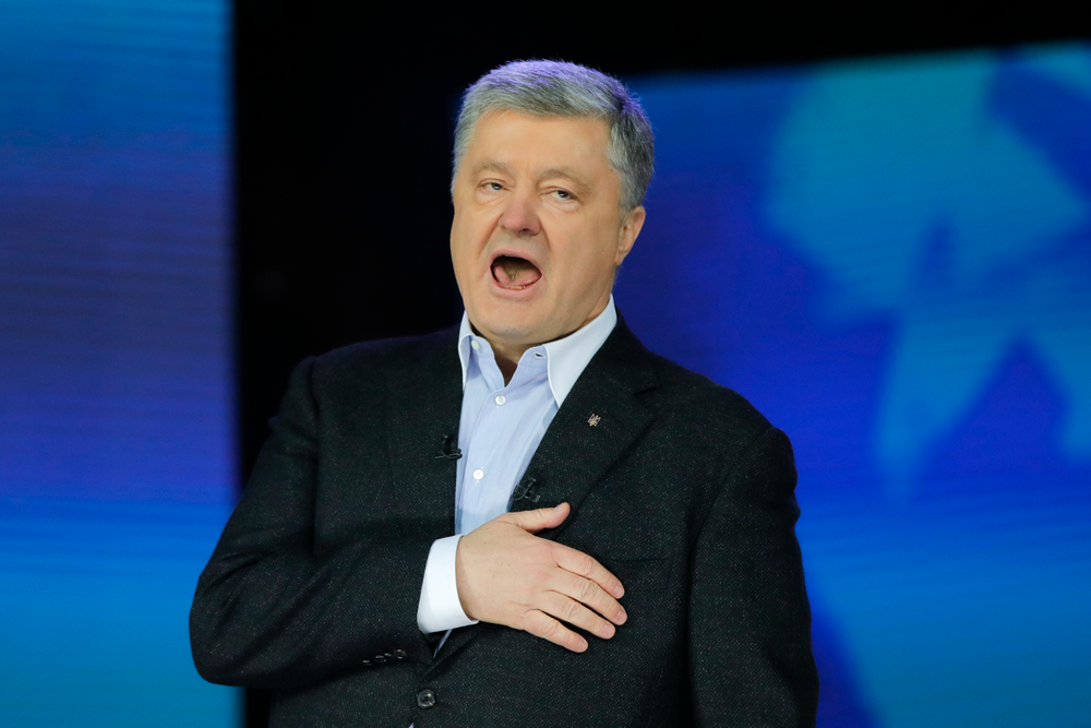 Ukrainian President Petro Poroshenko sings the national anthem after debates between two candidates in the weekend presidential run-off at the Olympic stadium in Kiev, Ukraine, Friday, April 19, 2019. Friday is the last official day of election canvassing in Ukraine as all presidential candidates and their campaigns will be barred from campaigning on Saturday, the day before the vote. (AP Photo/Vadim Ghirda) Ukrainian President Petro Poroshenko sings the national anthem after debates between two candidates in the weekend presidential run-off at the Olympic stadium in Kiev, Ukraine, Friday, April 19, 2019. Friday is the last official day of election canvassing in Ukraine as all presidential candidates and their campaigns will be barred from campaigning on Saturday, the day before the vote. (AP Photo/Vadim Ghirda)