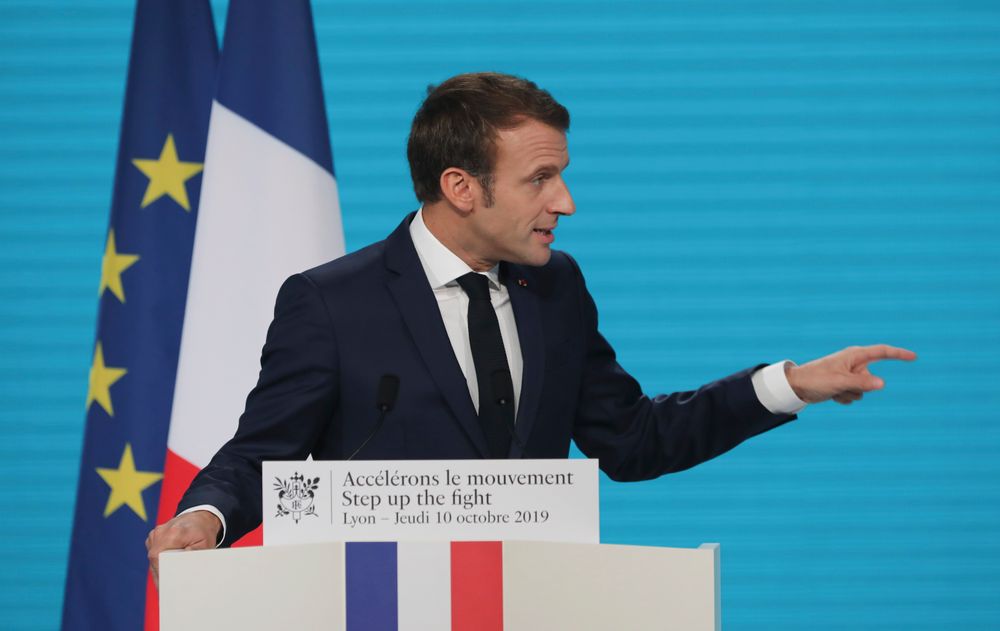 France's President Emmanuel Macron gestures as he delivers a speech at the Lyon's congress hall, central France, Thursday, Oct. 10, 2019, during the meeting of international lawmakers, health leaders and people affected by HIV, Tuberculosis and malaria. Lyon is hosting the two day Global Fund event aimed at raising money to help in the global fight against the epidemics. (AP Photo/Laurent Cipriani) France's President Emmanuel Macron gestures as he delivers a speech at the Lyon's congress hall, central France, Thursday, Oct. 10, 2019, during the meeting of international lawmakers, health leaders and people affected by HIV, Tuberculosis and malaria. Lyon is hosting the two day Global Fund event aimed at raising money to help in the global fight against the epidemics. (AP Photo/Laurent Cipriani)