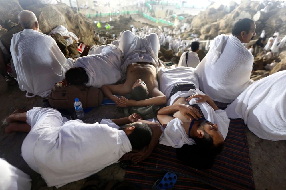 Muslim pilgrims take a nap on a rocky hill known as Mountain of Mercy, on the Plain of Arafat, during the annual hajj pilgrimage, ahead of sunrise near the holy city of Mecca, Saudi Arabia, Saturday, Aug. 10, 2019. More than 2 million pilgrims were gathered to perform initial rites of the hajj, an Islamic pilgrimage that takes the faithful along a path traversed by the Prophet Muhammad some 1,400 years ago. (AP Photo/Amr Nabil) Muslim pilgrims take a nap on a rocky hill known as Mountain of Mercy, on the Plain of Arafat, during the annual hajj pilgrimage, ahead of sunrise near the holy city of Mecca, Saudi Arabia, Saturday, Aug. 10, 2019. More than 2 million pilgrims were gathered to perform initial rites of the hajj, an Islamic pilgrimage that takes the faithful along a path traversed by the Prophet Muhammad some 1,400 years ago. (AP Photo/Amr Nabil)