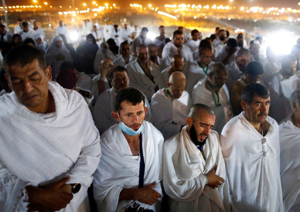 Muslim pilgrims offer dawn prayers on a rocky hill known as Mountain of Mercy, on the Plain of Arafat, during the annual hajj pilgrimage, ahead of sunrise near the holy city of Mecca, Saudi Arabia, Saturday, Aug. 10, 2019. More than 2 million pilgrims were gathered to perform initial rites of the hajj, an Islamic pilgrimage that takes the faithful along a path traversed by the Prophet Muhammad some 1,400 years ago. (AP Photo/Amr Nabil) Muslim pilgrims offer dawn prayers on a rocky hill known as Mountain of Mercy, on the Plain of Arafat, during the annual hajj pilgrimage, ahead of sunrise near the holy city of Mecca, Saudi Arabia, Saturday, Aug. 10, 2019. More than 2 million pilgrims were gathered to perform initial rites of the hajj, an Islamic pilgrimage that takes the faithful along a path traversed by the Prophet Muhammad some 1,400 years ago. (AP Photo/Amr Nabil)