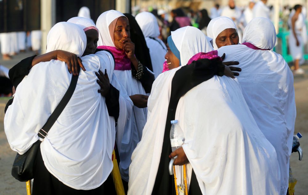Sudanese pilgrims embrace as they congratulate each other for performing the annual hajj pilgrimage near the Mountain of Mercy, on the Plain of Arafat, near the holy city of Mecca, Saudi Arabia, Saturday, Aug. 10, 2019. More than 2 million pilgrims were gathered to perform initial rites of the hajj, an Islamic pilgrimage that takes the faithful along a path traversed by the Prophet Muhammad some 1,400 years ago. (AP Photo/Amr Nabil) Sudanese pilgrims embrace as they congratulate each other for performing the annual hajj pilgrimage near the Mountain of Mercy, on the Plain of Arafat, near the holy city of Mecca, Saudi Arabia, Saturday, Aug. 10, 2019. More than 2 million pilgrims were gathered to perform initial rites of the hajj, an Islamic pilgrimage that takes the faithful along a path traversed by the Prophet Muhammad some 1,400 years ago. (AP Photo/Amr Nabil)