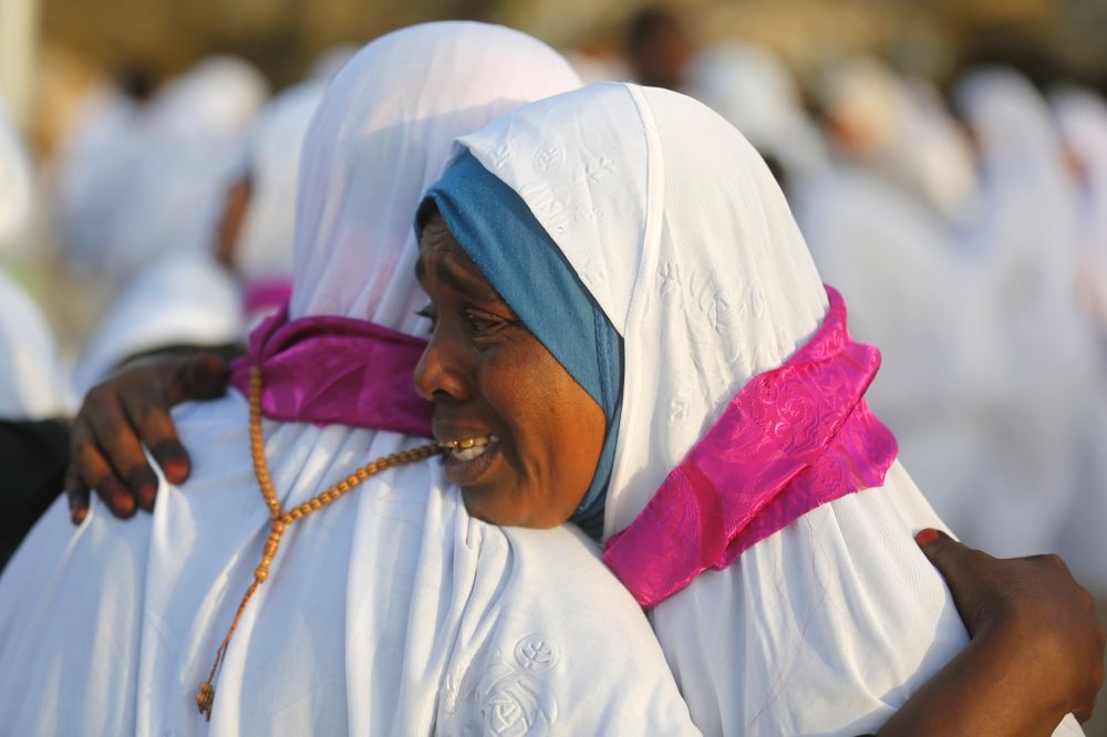 Sudanese pilgrims embrace as they congratulate each other for performing the the annual hajj pilgrimage near the Mountain of Mercy, on the Plain of Arafat, near the holy city of Mecca, Saudi Arabia, Saturday, Aug. 10, 2019. More than 2 million pilgrims were gathered to perform initial rites of the hajj, an Islamic pilgrimage that takes the faithful along a path traversed by the Prophet Muhammad some 1,400 years ago. (AP Photo/Amr Nabil) Sudanese pilgrims embrace as they congratulate each other for performing the the annual hajj pilgrimage near the Mountain of Mercy, on the Plain of Arafat, near the holy city of Mecca, Saudi Arabia, Saturday, Aug. 10, 2019. More than 2 million pilgrims were gathered to perform initial rites of the hajj, an Islamic pilgrimage that takes the faithful along a path traversed by the Prophet Muhammad some 1,400 years ago. (AP Photo/Amr Nabil)