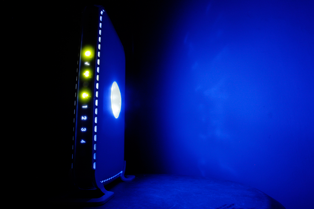 FILE- This July 27, 2008, file photo shows a, LED-illuminated wireless router in Philadelphia. Officials from the United States and Europe are announcing charges against 10 people in connection with malicious software attacks that infected tens of thousands of computers and caused more than $100 million in financial losses.(AP Photo/Matt Rourke, File) FILE- This July 27, 2008, file photo shows a, LED-illuminated wireless router in Philadelphia. Officials from the United States and Europe are announcing charges against 10 people in connection with malicious software attacks that infected tens of thousands of computers and caused more than $100 million in financial losses.(AP Photo/Matt Rourke, File)