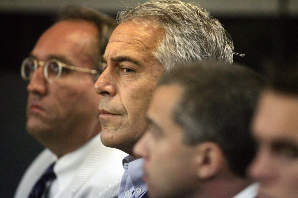 FILE - In this July 30, 2008 file photo, Jeffrey Epstein, center, appears in court in West Palm Beach, Fla. The wealthy financier pleaded not guilty in federal court in New York on Monday, July 8, 2019, to sex trafficking charges following his arrest over the weekend. Epstein will have to remain behind bars until his bail hearing on July 15. (Uma Sanghvi/Palm Beach Post via AP, File) FILE - In this July 30, 2008 file photo, Jeffrey Epstein, center, appears in court in West Palm Beach, Fla. The wealthy financier pleaded not guilty in federal court in New York on Monday, July 8, 2019, to sex trafficking charges following his arrest over the weekend. Epstein will have to remain behind bars until his bail hearing on July 15. (Uma Sanghvi/Palm Beach Post via AP, File)