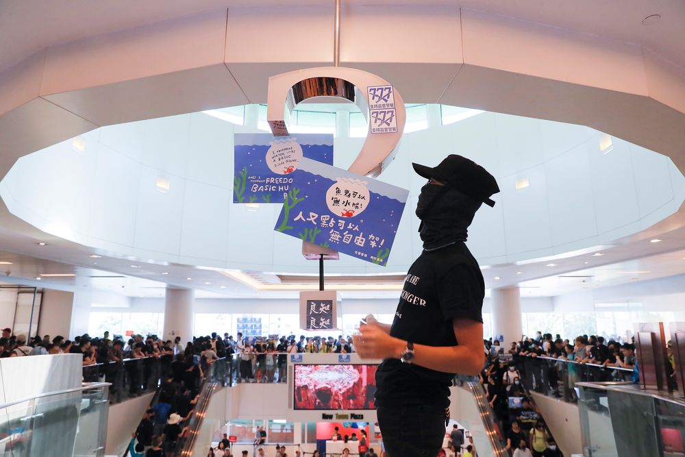 Anti-government protesters hold a rally in a shopping mall at the Sha Tin district in Hong Kong Sunday, Sept. 22, 2019. Protesters in Hong Kong burned a Chinese flag and police fired pepper spray Saturday in renewed clashes over grievances by the anti-government demonstrators. (AP Photo/Kin Cheung) Anti-government protesters hold a rally in a shopping mall at the Sha Tin district in Hong Kong Sunday, Sept. 22, 2019. Protesters in Hong Kong burned a Chinese flag and police fired pepper spray Saturday in renewed clashes over grievances by the anti-government demonstrators. (AP Photo/Kin Cheung)