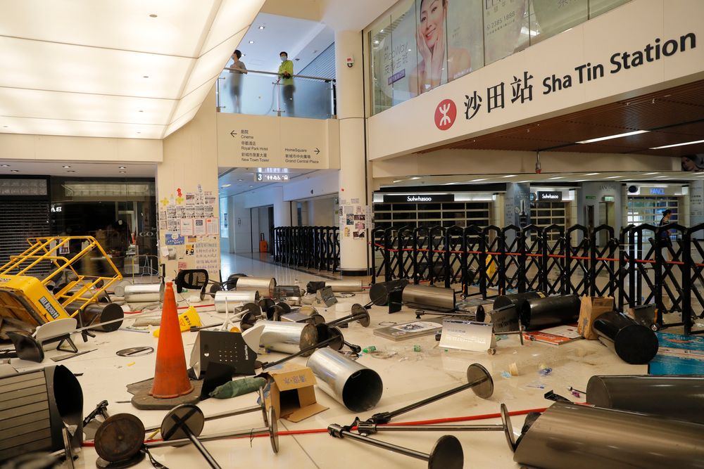 Protesters block the entrance to a subway station with debris Sunday, Sept. 22, 2019, in Hong Kong. Protesters smashed surveillance cameras and electronic ticket sensors in the subway station, as pro-democracy demonstrations took a violent turn once again. (AP Photo/Kin Cheung) Protesters block the entrance to a subway station with debris Sunday, Sept. 22, 2019, in Hong Kong. Protesters smashed surveillance cameras and electronic ticket sensors in the subway station, as pro-democracy demonstrations took a violent turn once again. (AP Photo/Kin Cheung)