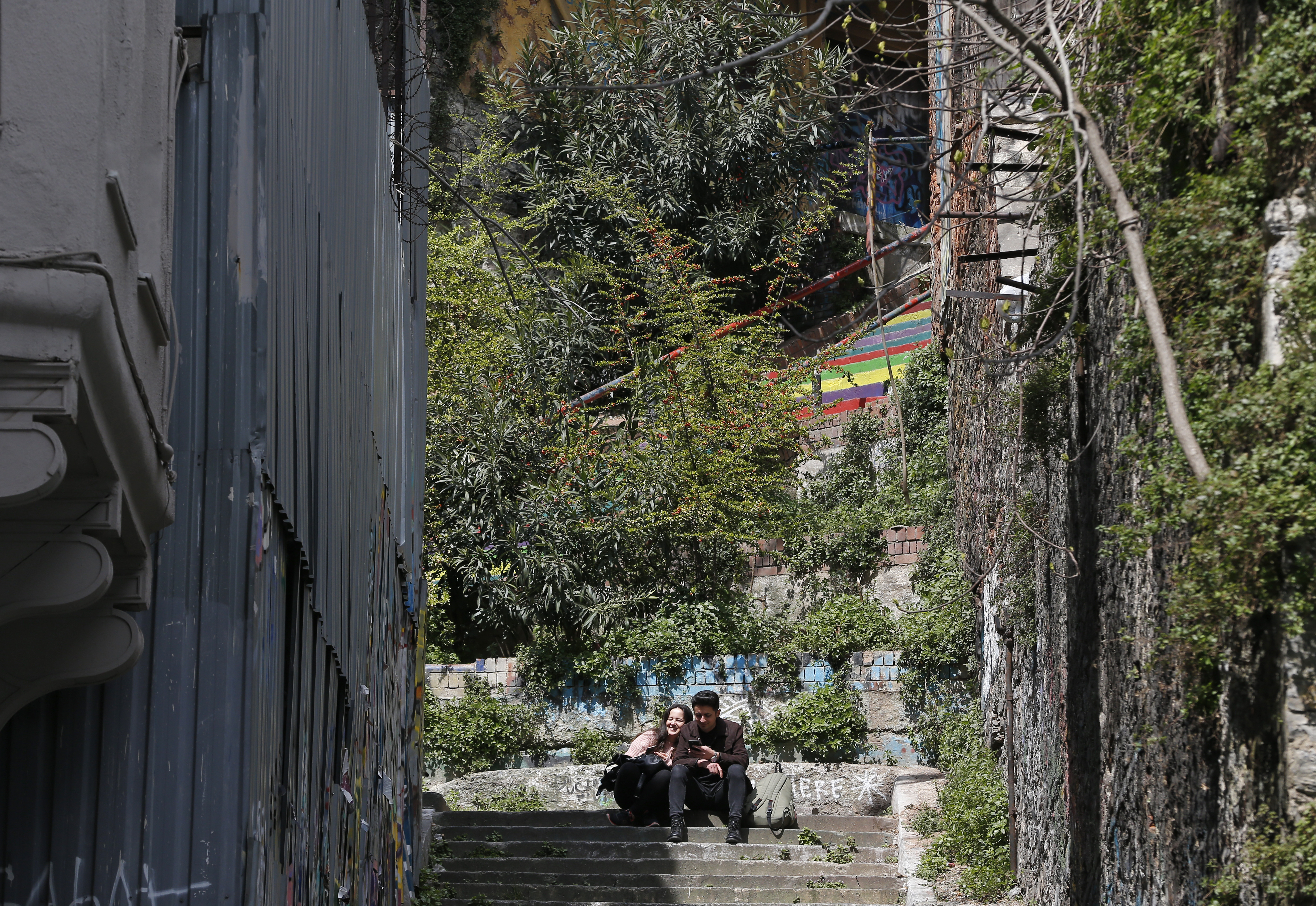 In this Thursday, April 4, 2019 photo, a couple sits in Istanbul's fashionable Cihangir neighbourhood. The mood among opposition supporters in Turkey's biggest city is one of jubilation but also worry - fear that their win in Istanbul's mayoral race could be overturned in a recount taking place after the ruling party challenged the election results. (AP Photo/Lefteris Pitarakis) In this Thursday, April 4, 2019 photo, a couple sits in Istanbul's fashionable Cihangir neighbourhood. The mood among opposition supporters in Turkey's biggest city is one of jubilation but also worry - fear that their win in Istanbul's mayoral race could be overturned in a recount taking place after the ruling party challenged the election results. (AP Photo/Lefteris Pitarakis)
