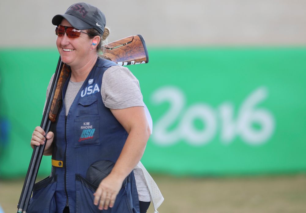 FILE -- In this Aug. 12, 2016 file photo Kimberly Rhode of the United States smiles after she won the bronze medal match of the women's skeet event at Olympic Shooting Center at the 2016 Summer Olympics in Rio de Janeiro, Brazil. Rhode, who has medaled in six straight Olympic Games, is the star plaintiff in a lawsuit to stop a 2016 voter-approved ballot initiative requiring background checks for the purchase of ammunition that is to take effect July 1. (AP Photo/Eugene Hoshiko, File) FILE -- In this Aug. 12, 2016 file photo Kimberly Rhode of the United States smiles after she won the bronze medal match of the women's skeet event at Olympic Shooting Center at the 2016 Summer Olympics in Rio de Janeiro, Brazil. Rhode, who has medaled in six straight Olympic Games, is the star plaintiff in a lawsuit to stop a 2016 voter-approved ballot initiative requiring background checks for the purchase of ammunition that is to take effect July 1. (AP Photo/Eugene Hoshiko, File)