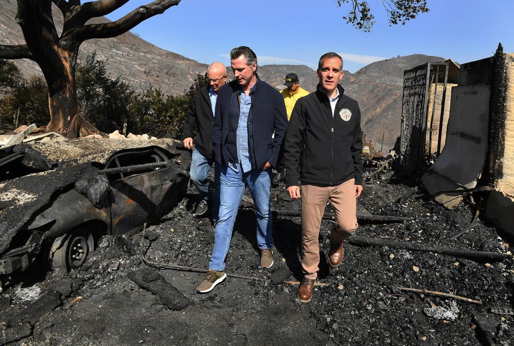 From left, L.A. City Councilman Mike Bonin, California Governor Gavin Newsom and L.A. City Mayor Eric Garcetti tour a burned home along Tigertail Road in Brentwood, Calif., Tuesday Oct. 29, 2019. (Wally Skalij/Los Angeles Times via AP, Pool) From left, L.A. City Councilman Mike Bonin, California Governor Gavin Newsom and L.A. City Mayor Eric Garcetti tour a burned home along Tigertail Road in Brentwood, Calif., Tuesday Oct. 29, 2019. (Wally Skalij/Los Angeles Times via AP, Pool)