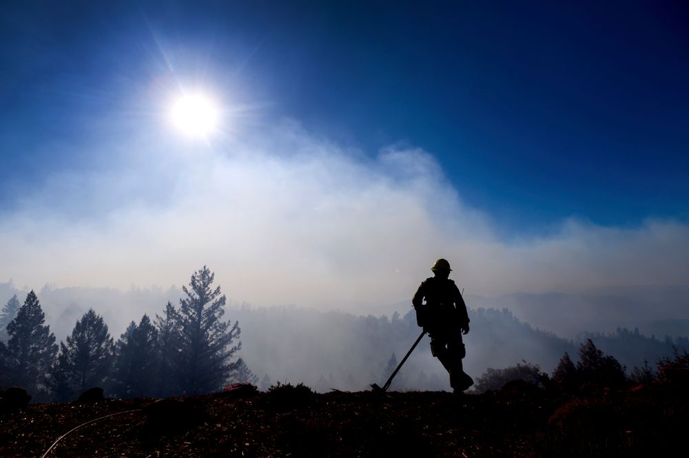 Firefighter Josh Petrell monitors the Kincade Fire burning near Healdsburg, Calif., on Tuesday, Oct. 29, 2019. The overall weather picture in northern areas is improving as powerful, dry winds bring extreme fire weather to Southern California. (AP Photo/Noah Berger) Firefighter Josh Petrell monitors the Kincade Fire burning near Healdsburg, Calif., on Tuesday, Oct. 29, 2019. The overall weather picture in northern areas is improving as powerful, dry winds bring extreme fire weather to Southern California. (AP Photo/Noah Berger)