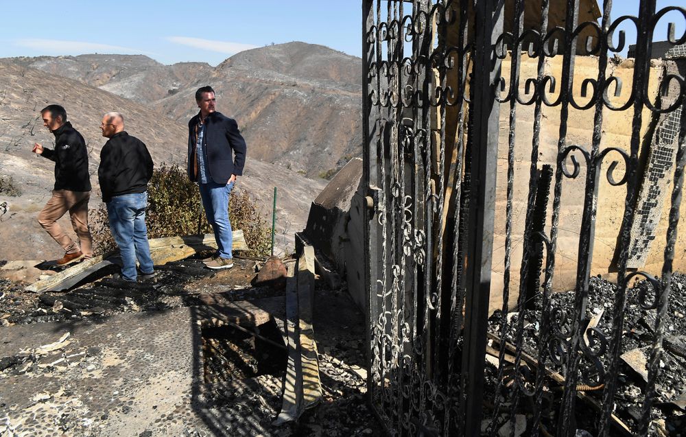 From left, L.A. Mayor Eric Garcetti, L.A. City Councilman Mike Bonin and California Governor Gavin Newsom view a burned and home along Tigertail Road in Brentwood, Calif., Tuesday Oct. 29, 2019. (Wally Skalij/Los Angeles Times via AP, Pool) From left, L.A. Mayor Eric Garcetti, L.A. City Councilman Mike Bonin and California Governor Gavin Newsom view a burned and home along Tigertail Road in Brentwood, Calif., Tuesday Oct. 29, 2019. (Wally Skalij/Los Angeles Times via AP, Pool)