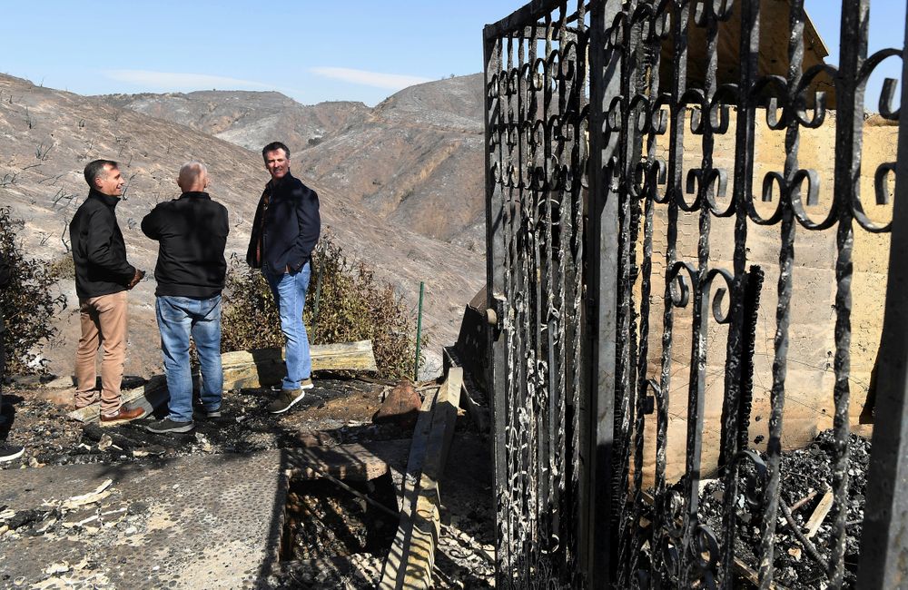From left, L.A. Mayor Eric Garcetti, L.A. City Councilman Mike Bonin and California Governor Gavin Newsom view a burned and home along Tigertail Road in Brentwood, Calif., Tuesday Oct. 29, 2019. (Wally Skalij/Los Angeles Times via AP, Pool) From left, L.A. Mayor Eric Garcetti, L.A. City Councilman Mike Bonin and California Governor Gavin Newsom view a burned and home along Tigertail Road in Brentwood, Calif., Tuesday Oct. 29, 2019. (Wally Skalij/Los Angeles Times via AP, Pool)