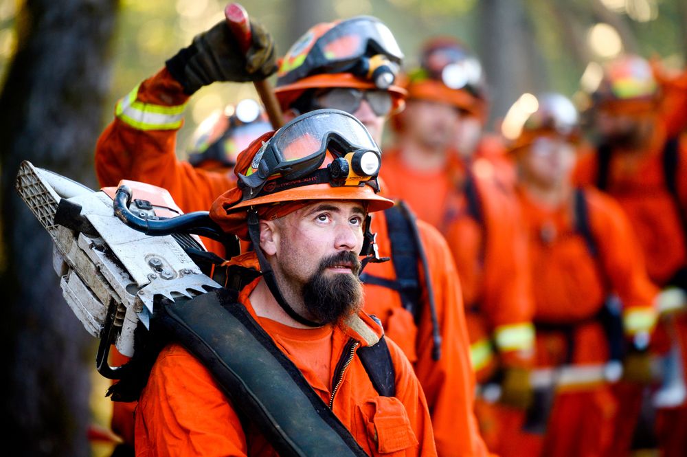 Inmate firefighters prepare to battle the Kincade Fire near Healdsburg, Calif., on Tuesday, Oct. 29, 2019. (AP Photo/Noah Berger) Inmate firefighters prepare to battle the Kincade Fire near Healdsburg, Calif., on Tuesday, Oct. 29, 2019. (AP Photo/Noah Berger)