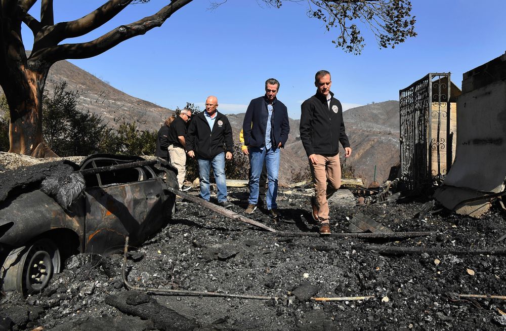 From left, L.A. City Councilman Mike Bonin, California Governor Gavin Newsom and L.A. City Mayor Eric Garcetti tour a burned home along Tigertail Road in Brentwood, Calif., Tuesday Oct. 29, 2019. (Wally Skalij/Los Angeles Times via AP, Pool) From left, L.A. City Councilman Mike Bonin, California Governor Gavin Newsom and L.A. City Mayor Eric Garcetti tour a burned home along Tigertail Road in Brentwood, Calif., Tuesday Oct. 29, 2019. (Wally Skalij/Los Angeles Times via AP, Pool)