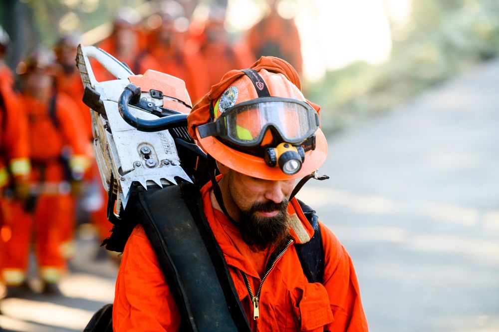 Inmate firefighters prepare to battle the Kincade Fire near Healdsburg, Calif., on Tuesday, Oct. 29, 2019. Millions of people have been without power for days as fire crews race to contain two major wind-whipped blazes that have destroyed dozens of homes at both ends of the state: in Sonoma County wine country and in the hills of Los Angeles. (AP Photo/Noah Berger) Inmate firefighters prepare to battle the Kincade Fire near Healdsburg, Calif., on Tuesday, Oct. 29, 2019. Millions of people have been without power for days as fire crews race to contain two major wind-whipped blazes that have destroyed dozens of homes at both ends of the state: in Sonoma County wine country and in the hills of Los Angeles. (AP Photo/Noah Berger)