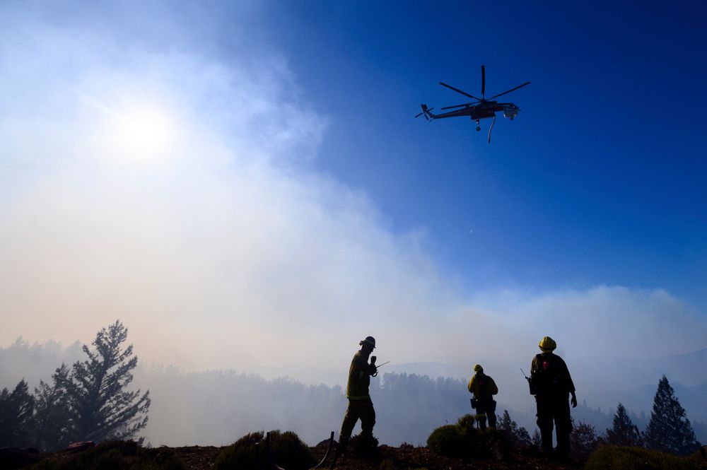 Firefighters monitor the Kincade Fire burning near Healdsburg, Calif., on Tuesday, Oct. 29, 2019. The overall weather picture in northern areas is improving, as powerful, dry winds bring extreme fire weather to Southern California. (AP Photo/Noah Berger) Firefighters monitor the Kincade Fire burning near Healdsburg, Calif., on Tuesday, Oct. 29, 2019. The overall weather picture in northern areas is improving, as powerful, dry winds bring extreme fire weather to Southern California. (AP Photo/Noah Berger)