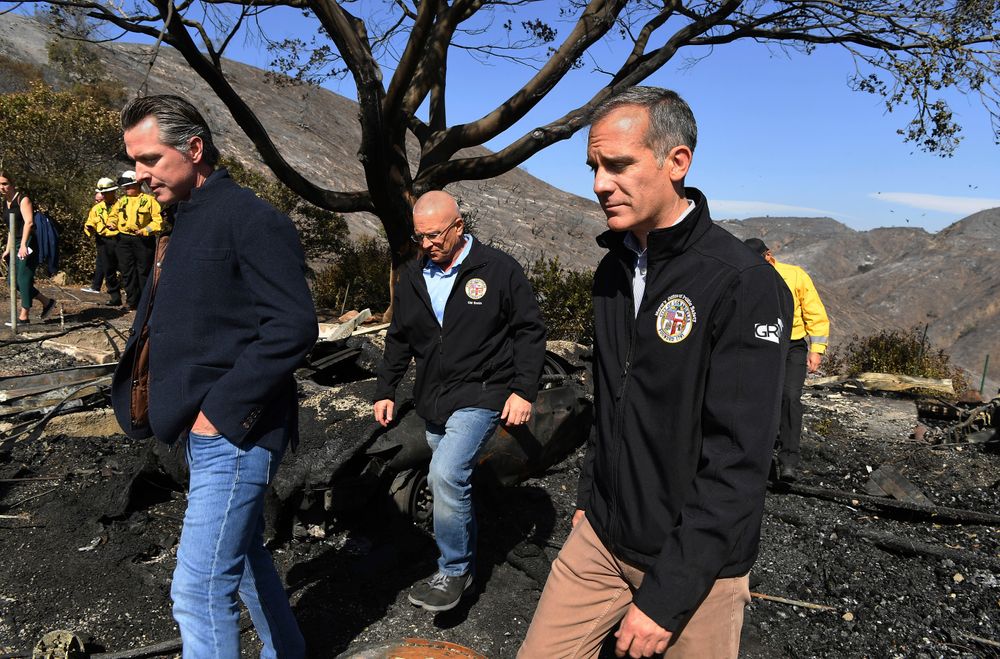 From left, California Governor Gavin Newsome, L.A. City Councilman Mike Bonin, and L.A. City Mayor Eric Garcetti tour a burned home along Tigertail Road in Brentwood, Calif., Tuesday Oct. 29, 2019. (Wally Skalij/Los Angeles Times via AP, Pool) From left, California Governor Gavin Newsome, L.A. City Councilman Mike Bonin, and L.A. City Mayor Eric Garcetti tour a burned home along Tigertail Road in Brentwood, Calif., Tuesday Oct. 29, 2019. (Wally Skalij/Los Angeles Times via AP, Pool)