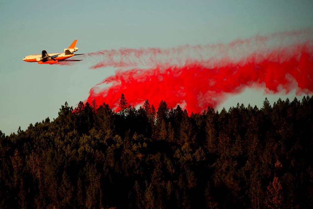 An air tanker drops retardant while battling the Kincade Fire near Healdsburg, Calif., on Tuesday, Oct. 29, 2019. The overall weather picture in northern areas is improving as powerful, dry winds bring extreme fire weather to Southern California. (AP Photo/Noah Berger) An air tanker drops retardant while battling the Kincade Fire near Healdsburg, Calif., on Tuesday, Oct. 29, 2019. The overall weather picture in northern areas is improving as powerful, dry winds bring extreme fire weather to Southern California. (AP Photo/Noah Berger)