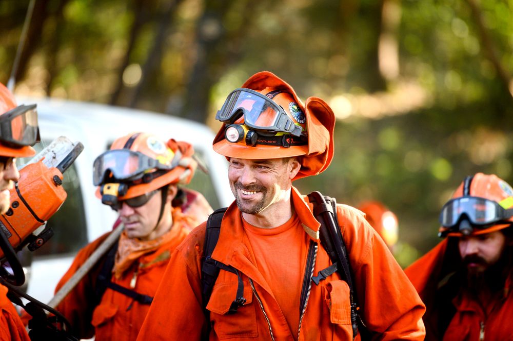 Inmate firefighters prepare to battle the Kincade Fire near Healdsburg, Calif., on Tuesday, Oct. 29, 2019. The overall weather picture in northern areas is improving, as powerful, dry winds bring extreme fire weather to Southern California. (AP Photo/Noah Berger) Inmate firefighters prepare to battle the Kincade Fire near Healdsburg, Calif., on Tuesday, Oct. 29, 2019. The overall weather picture in northern areas is improving, as powerful, dry winds bring extreme fire weather to Southern California. (AP Photo/Noah Berger)