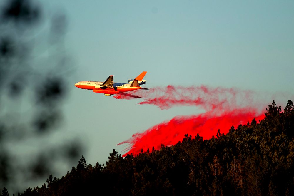 An air tanker drops retardant while battling the Kincade Fire near Healdsburg, Calif., on Tuesday, Oct. 29, 2019. The overall weather picture in northern areas is improving, as powerful, dry winds bring extreme fire weather to Southern California. (AP Photo/Noah Berger) An air tanker drops retardant while battling the Kincade Fire near Healdsburg, Calif., on Tuesday, Oct. 29, 2019. The overall weather picture in northern areas is improving, as powerful, dry winds bring extreme fire weather to Southern California. (AP Photo/Noah Berger)